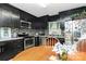 Kitchen with adjacent dining area showcases stainless steel appliances and abundant cabinetry at 8301 Washington Blvd, Charlotte, NC 28262