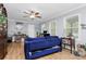 Cozy living room features wood floors, a ceiling fan, and great natural light at 8301 Washington Blvd, Charlotte, NC 28262