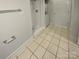 Bathroom featuring a walk-in shower and stacked washer dryer at 8929 Meadow Vista Rd, Charlotte, NC 28213