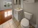 Cozy bathroom with white vanity, gold fixtures, neutral walls, and natural light at 8929 Meadow Vista Rd, Charlotte, NC 28213