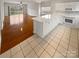 Kitchen and living area with hardwood floors and island for open concept living at 8929 Meadow Vista Rd, Charlotte, NC 28213