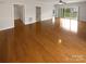 Spacious living area featuring hardwood floors and access to outdoor patio with natural light at 8929 Meadow Vista Rd, Charlotte, NC 28213
