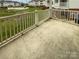 View from outdoor patio features community yard, pool, and neighboring buildings at 8929 Meadow Vista Rd, Charlotte, NC 28213