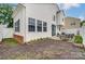 Backyard patio features modern seating and a well-maintained lawn at 9052 Meadowmont View Dr, Charlotte, NC 28269