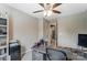 Spacious bedroom with a functional desk and computer area plus a view to the hallway at 9052 Meadowmont View Dr, Charlotte, NC 28269