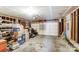 Spacious garage with exposed framework, concrete flooring, and a large door for easy access at 9052 Meadowmont View Dr, Charlotte, NC 28269