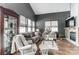 Comfortable living room with vaulted ceilings, large windows, and modern furnishings at 9052 Meadowmont View Dr, Charlotte, NC 28269