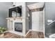 Inviting living room showcasing a fireplace, TV, and front door access at 9052 Meadowmont View Dr, Charlotte, NC 28269