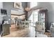 Bright living area with kitchen access, dining table, and comfortable seating at 9052 Meadowmont View Dr, Charlotte, NC 28269