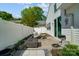Private patio is perfect for outdoor relaxation, with a grill, seating, and mature greenery at 9052 Meadowmont View Dr, Charlotte, NC 28269