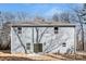 Backyard of this home features a sliding glass door and a small patio at 1034 Dooley Dr, Charlotte, NC 28227