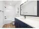 Bathroom with black fixtures, walk-in shower, and vanity with sink at 1034 Dooley Dr, Charlotte, NC 28227