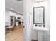 Powder room with pedestal sink and view into the kitchen at 1034 Dooley Dr, Charlotte, NC 28227