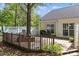 Inviting backyard deck is partially fenced, and features outdoor dining and grilling area at 11841 Mourning Dove Ln, Charlotte, NC 28269