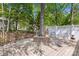 Unique backyard deck design with built-in tree surround, partially fenced with outdoor seating at 11841 Mourning Dove Ln, Charlotte, NC 28269