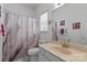 Bright bathroom with tub and shower, featuring marble floors and elegant accents at 11841 Mourning Dove Ln, Charlotte, NC 28269