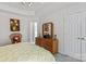 Comfortable bedroom features carpet, wooden dresser, and closet at 11841 Mourning Dove Ln, Charlotte, NC 28269