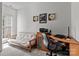 Functional home office space with desk, futon, and natural light at 11841 Mourning Dove Ln, Charlotte, NC 28269