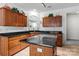 Spacious kitchen featuring stainless steel appliances, dark countertops, and a central island at 11841 Mourning Dove Ln, Charlotte, NC 28269