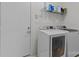 Well-lit laundry room features modern Samsung washer and dryer, with storage shelf above appliances at 11841 Mourning Dove Ln, Charlotte, NC 28269