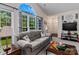Cozy living room featuring large arched windows, comfortable sofa and media center at 11841 Mourning Dove Ln, Charlotte, NC 28269