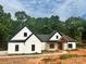 New construction featuring a white exterior, black trim, and a covered porch with a wood beam accent at 12069 Coyle Rd, Stanfield, NC 28163