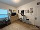 Bright bedroom with a cozy seating area, unique art, and neutral tones at 123 Grey Fox Ln, Mount Gilead, NC 27306