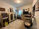 Fun bedroom featuring unique decor, including a vintage arcade game, and a comfortable, playful atmosphere at 123 Grey Fox Ln, Mount Gilead, NC 27306