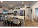 Stylish kitchen with a large island, seating, stainless steel appliances, and elegant white cabinetry at 123 Grey Fox Ln, Mount Gilead, NC 27306