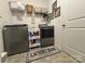 Clean, spacious laundry room with modern washer and dryer, plus decorative rug at 123 Grey Fox Ln, Mount Gilead, NC 27306