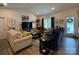 Comfortable living room with stylish furnishings, neutral colors, and large windows, perfect for relaxation and entertaining at 123 Grey Fox Ln, Mount Gilead, NC 27306