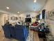 Bright and airy living room with modern decor, comfortable seating, and large windows, creating a welcoming space at 123 Grey Fox Ln, Mount Gilead, NC 27306