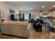 Spacious living room with a modern design, featuring comfortable seating, a large TV, and lots of natural light at 123 Grey Fox Ln, Mount Gilead, NC 27306