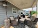 A covered patio area is furnished with a heater, fan, and outdoor seating creating a relaxing space at 123 Grey Fox Ln, Mount Gilead, NC 27306
