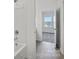 Bathroom with bathtub, tile floor, and doorway leading to a bedroom at 13737 Roderick Dr # 186, Huntersville, NC 28078