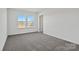 Bright bedroom with natural light, offering a serene and inviting atmosphere for relaxation and comfort at 13737 Roderick Dr # 186, Huntersville, NC 28078