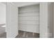 Organized closet with shelving, maximizing storage space for a tidy and functional home at 13737 Roderick Dr # 186, Huntersville, NC 28078