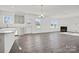 Open-concept floor plan combines the kitchen and living room with gas fireplace and views to the outdoors at 13737 Roderick Dr # 186, Huntersville, NC 28078