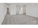 Spacious loft area with gray carpet at 13737 Roderick Dr # 186, Huntersville, NC 28078