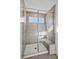 Tiled shower with glass enclosure, bench, and modern fixtures, providing a spa-like experience at 13737 Roderick Dr # 186, Huntersville, NC 28078