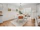 Bright dining room featuring a round table, stylish chairs, and natural light at 13752 Roderick Dr # 175, Huntersville, NC 28078