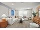 Spacious living room featuring a large sectional sofa, stylish decor, and ample natural light at 13752 Roderick Dr # 175, Huntersville, NC 28078