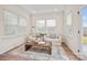 Living room filled with natural light, a comfortable couch, and stylish decor at 13752 Roderick Dr # 175, Huntersville, NC 28078