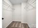 A large walk-in closet includes carpeted flooring and metal shelving at 13752 Roderick Dr # 175, Huntersville, NC 28078