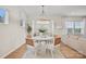 Bright dining room features a round table, stylish chairs, and flows into the living area at 15019 Meadows Hunt Ln # 163, Huntersville, NC 28078