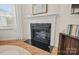 Modern fireplace with white mantel and black surround, providing a cozy focal point at 15019 Meadows Hunt Ln # 163, Huntersville, NC 28078
