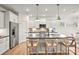 Bright kitchen with a center island, seating, stainless steel appliances, and plenty of cabinet space at 15019 Meadows Hunt Ln # 163, Huntersville, NC 28078