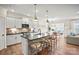 Bright kitchen featuring a spacious island, modern appliances, and stylish pendant lighting at 15019 Meadows Hunt Ln # 163, Huntersville, NC 28078