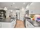 Modern kitchen featuring an island with bar stool seating, stainless appliances, and an open layout at 15019 Meadows Hunt Ln # 163, Huntersville, NC 28078