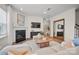 Stylish living room features a fireplace, large mirror, and a comfortable sectional sofa at 15019 Meadows Hunt Ln # 163, Huntersville, NC 28078